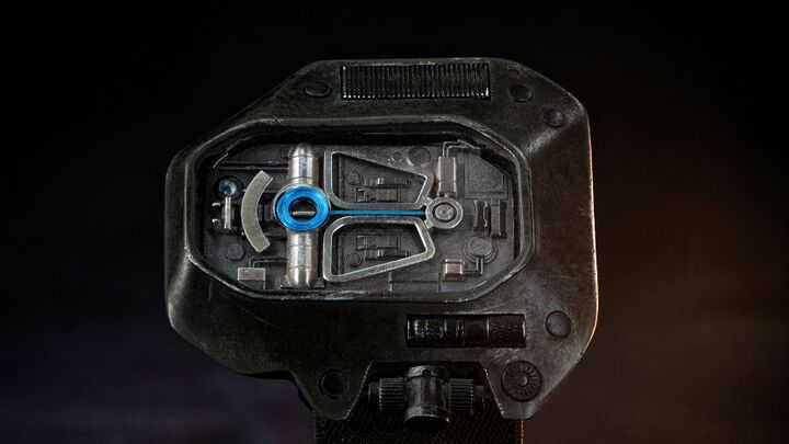 Asymmetrical black Dune Desert Watch prop with exposed relief dial and blue channel