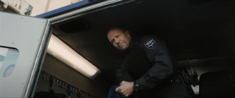 Jason Statham as H (Patrick Hill) with the IWC Pilot's Watch Double Chronograph Top Gun Ceratanium IW371815 in Wrath of Man (2021)