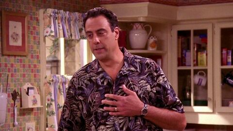 Brad Garrett as Robert Barone with the Breitling Chronomat in Everybody Loves Raymond (1996)
