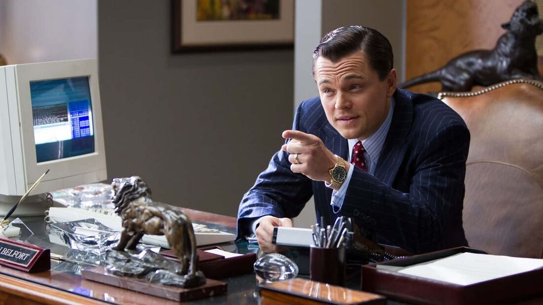 Leonardo DiCaprio wearing a gold-tone TAG Heuer 1000 Series in The Wolf of Wall Street