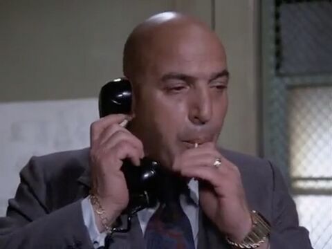 Telly Savalas as Theo Kojak with the Omega Time Computer 1 in Kojak (1973)
