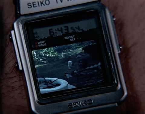 Roger Moore as James Bond with the Seiko TV Watch in Octopussy (1983)