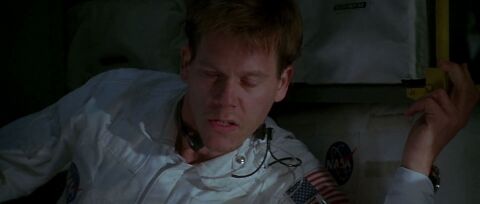 Kevin Bacon as Jack Swigert with the Omega Speedmaster Professional in Apollo 13 (1995)