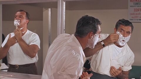 Cary Grant as Roger O. Thornhill with the Cartier Tank in North by Northwest (1959)