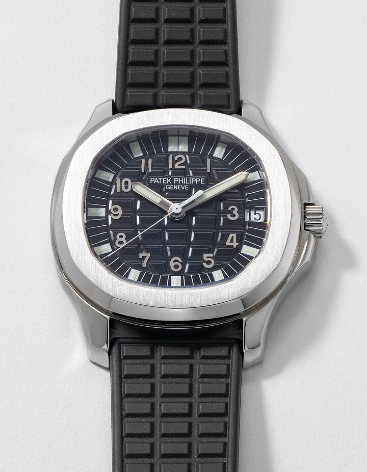 A first-generation Aquanaut with a raised rectangular dial pattern and dark strap.