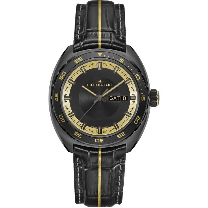 Black-and-gold Hamilton Pan Europ with a rotating bezel, day-date display and leather strap.