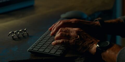 Campbell Scott as Lewis Dodgson with the Lilienthal Berlin Chronograph in Jurassic World Dominion (2022)