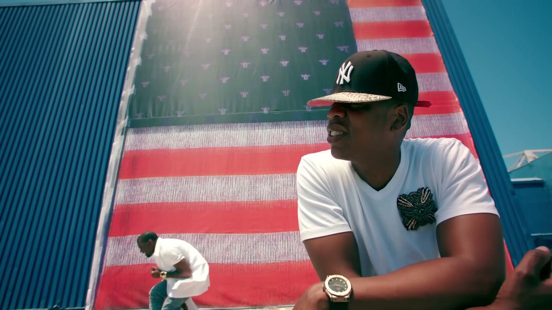 Jay-Z performs in a white T-shirt with a dark-dial Hublot visible on his wrist.