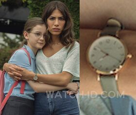 Round gold watch green strap