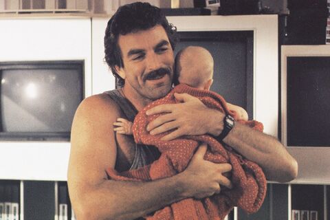 Tom Selleck as Peter Mitchell with the Timex Ironman in Three Men and a Baby (1987)