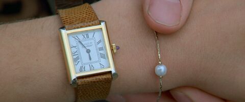 Mia Sara as Sloane Peterson with the Cartier Must de Cartier tank watch in Ferris Bueller's Day Off (1986)