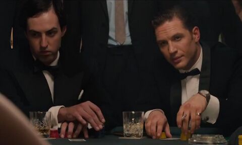 Tom Hardy as Reggie Kray with the Reggie Kray's Omega in Legend (2015)