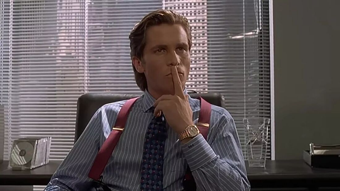 Christian Bale wearing a Seiko 5 SNXJ90 in American Psycho