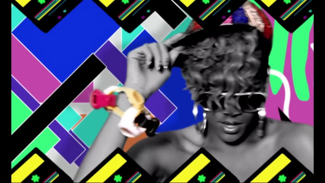 Rihanna raises linked pink, yellow, white and black watches against a bright geometric background.