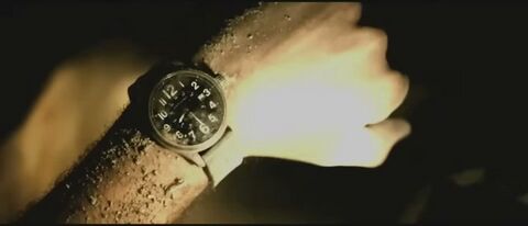 Ryan Reynolds as Paul Conroy with the Hamilton Khaki Field Officer in Buried (2010)