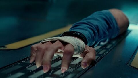 Chris O'Dowd as Mundy with the Cloverfield Station wristwatch communicator in The Cloverfield Paradox (2018)