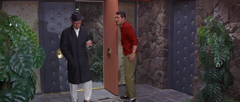 Dean Martin as Ernie Brewer with the Bulova (unidentified model) in Marriage on the Rocks (1965)