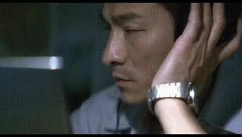 Andy Lau as Lau Kin-ming with the IWC GST in Infernal Affairs (2002)