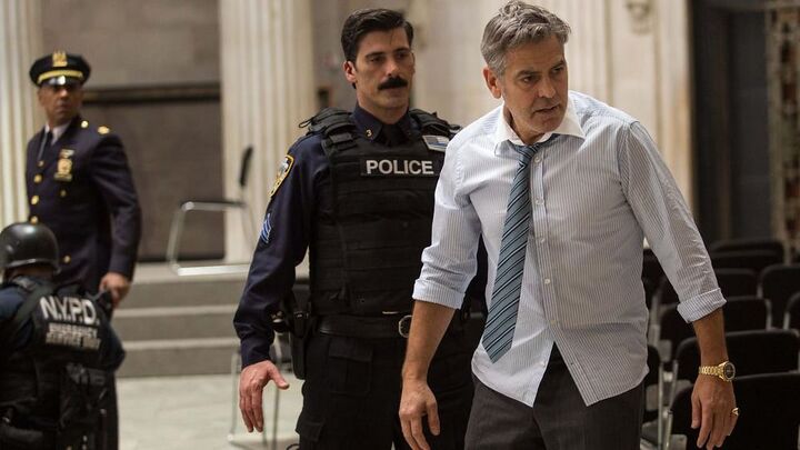 George Clooney wearing a gold Omega Speedmaster in Money Monster