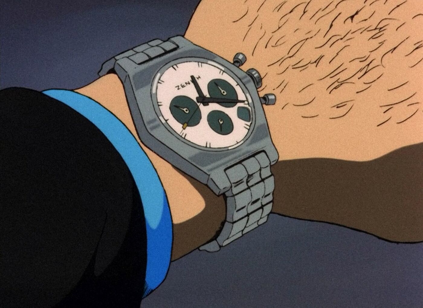 Jigen’s wrist carries a pale Zenith chronograph with three dark registers and a metal bracelet.