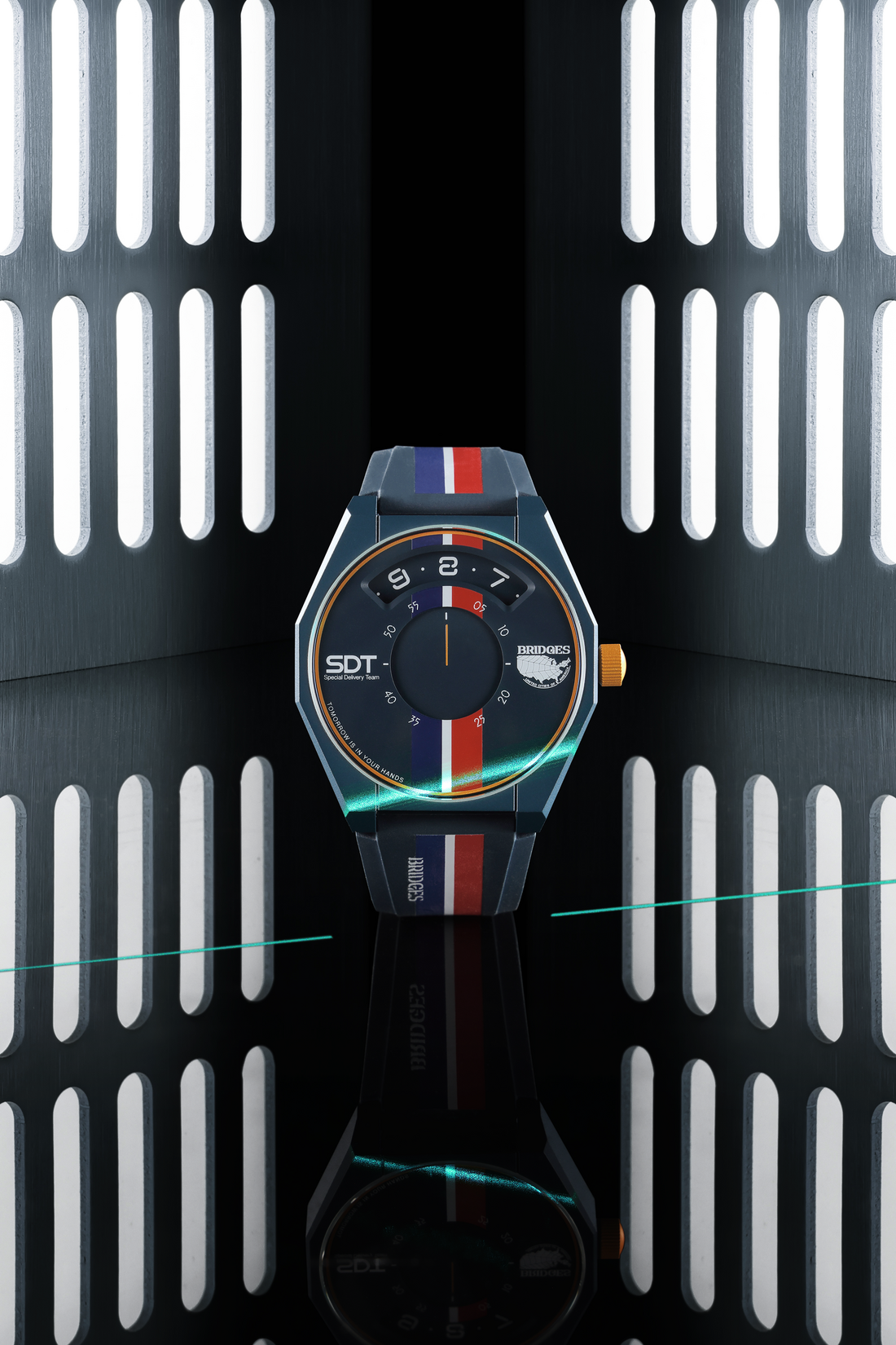 Round black watch with bright colored dial markings on a translucent dark strap.