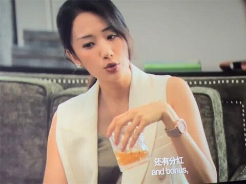 The wearer as Shuangshuang with the Patek Philippe Aquanaut 5072R in No More Bets (2023)