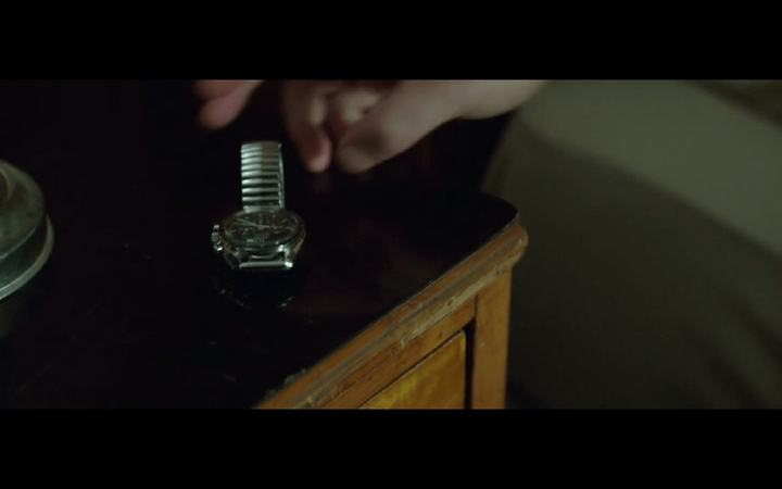 Russell Crowe wearing a Speedmaster in The Nice Guys