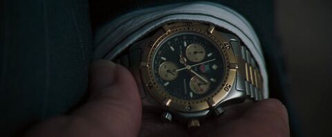 Stanley Anderson as Edwin Sneller with the TAG Heuer (unidentified model) in The Pelican Brief (1993)