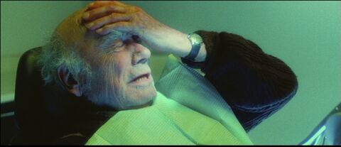 André Dussollier as Georges Palet with the Hamilton Khaki Field in Wild Grass (2009)