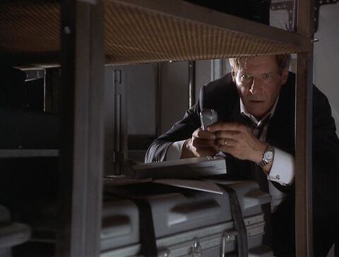 Harrison Ford as James Marshall with the IWC watch in Air Force One (1997)