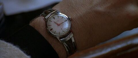 Kevin Spacey as Jack Vincennes with the Bulova Surf King in L.A. Confidential (1997)