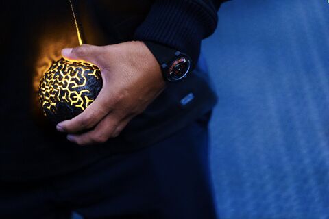 Michael Peña as Ansel Argon with the Urwerk UR-100 in Secret Headquarters (2022)