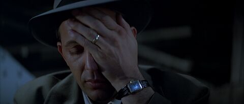 Kevin Costner as Eliot Ness with the Bulova (unidentified model) in The Untouchables (1987)
