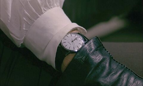 Charles Bronson as Franz Propp with the Longines Jamboree 6884-5 in Farewell, Friend (1968)