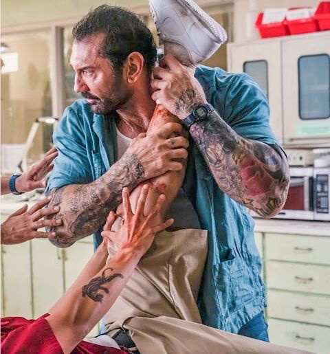 Dave Bautista as Vic Manning with the Armitron 45/7004BLU in Stuber (2019)