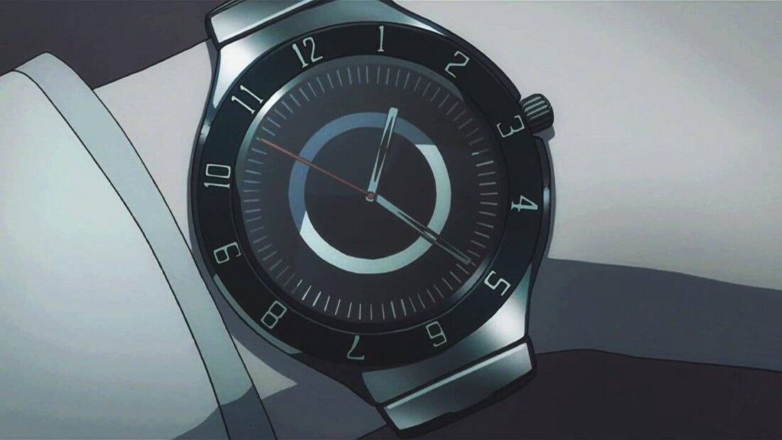 Light’s round watch has Arabic numerals around a black outer ring and a pale broken circle on the dial.