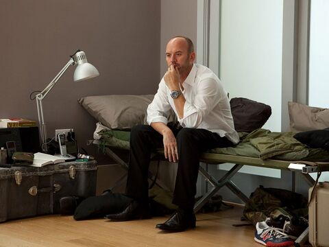 Mark Womack as Fergus Molloy with the Breitling Colt in Route Irish (2010)